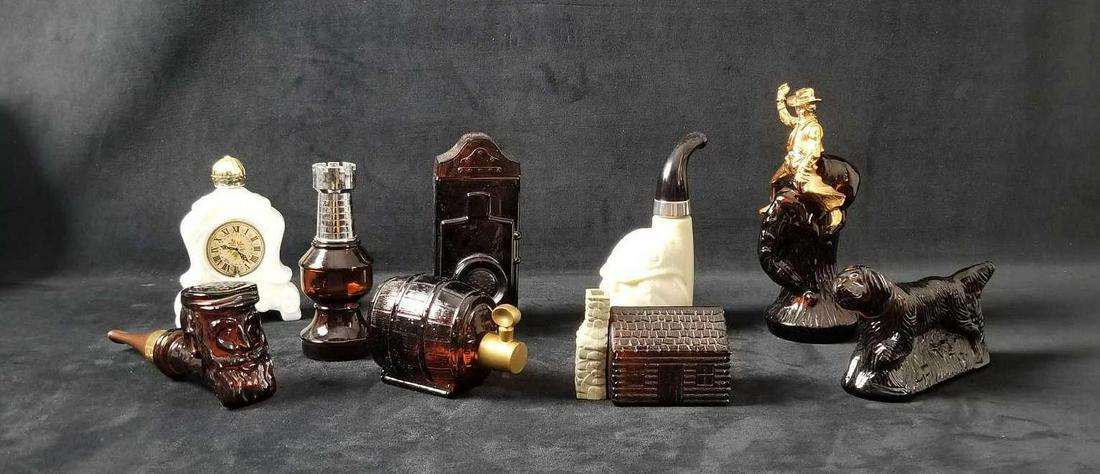 Assorted Avon Glass Decanters Lot Of 9: Assorted Avon Glass Decanters lot of 9 contains: 1- Cabin " Wild Country" bottle is empty with label on the bottom. Approx. measures 4" x 2" x 3" 1- Dog " At Point" half full with label on bottom. The