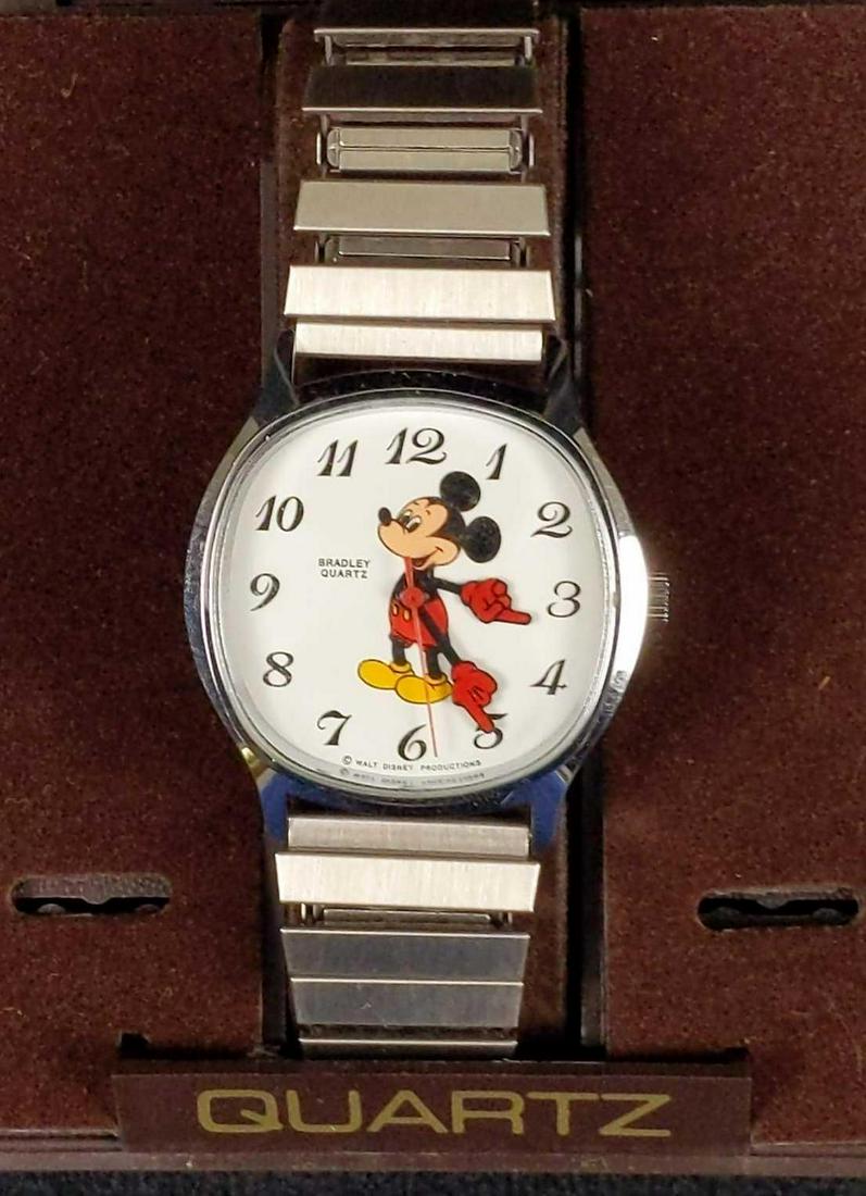 Vintage Disney Bradley Mickey Watch W Stretch Band: Bradley 1970's Men's Disney Mickey Mouse Quartz Watch With Rare Metal Stretch Band. Watch comes in its original box which is approx 3 1/2 x 4" x 4" x 3". Stainless steel back and bezel. Made in Hong K