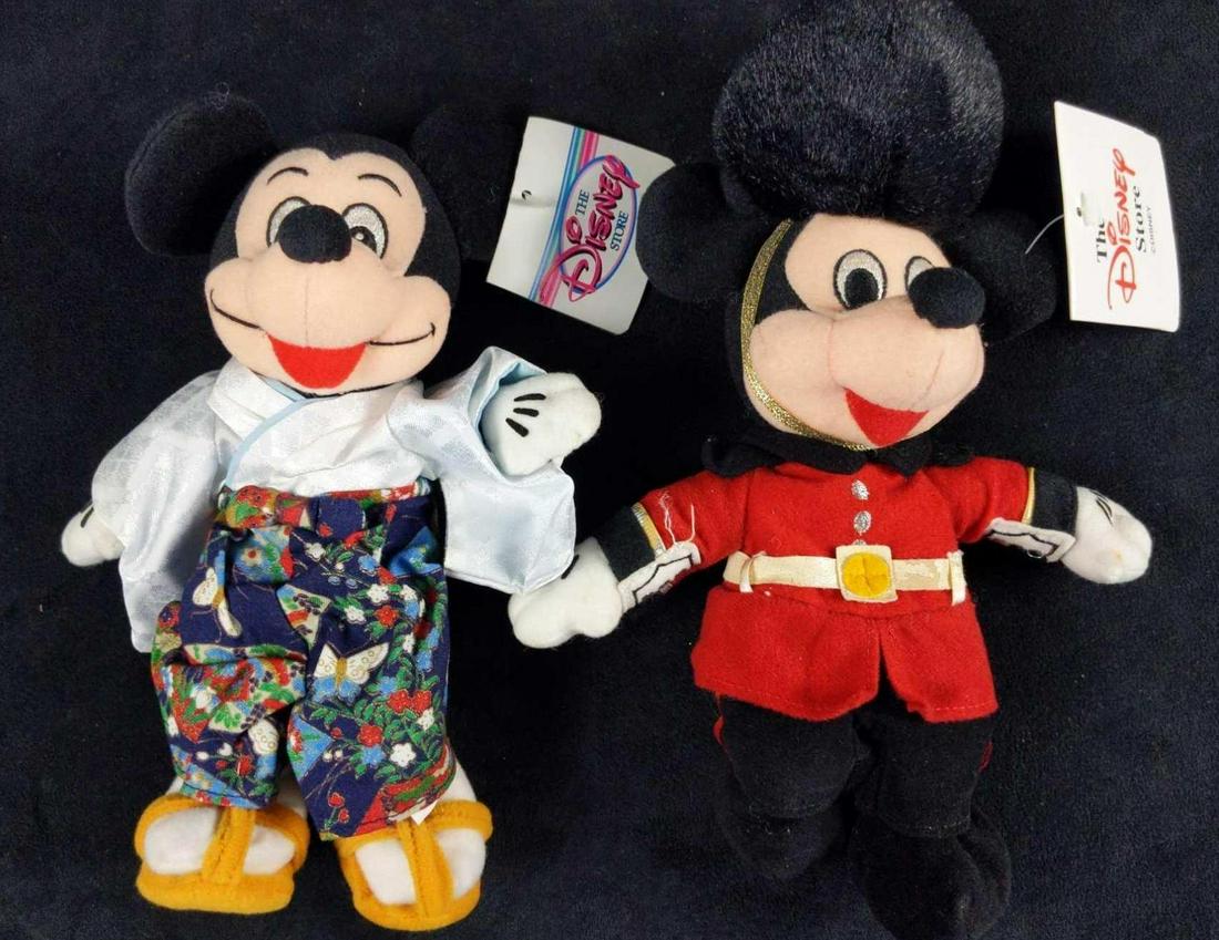 2 Vintage Disney Store Mickey Mouse Bean Bag Dolls: This lot includes: (1) The Disney Store Mickey Mouse Palace Guard. Is approx 8" 1" x 10". Belt and sleeves have light damage and some marks on Mickey's gloves. (1) Tokyo Disney Store Exclusive Mickey 