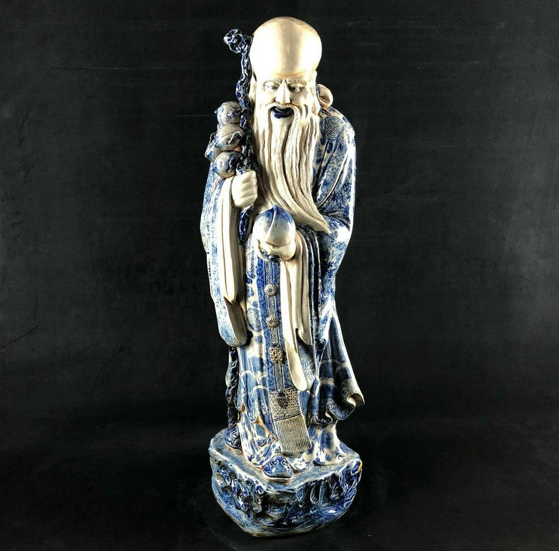 Massive Antique Chinese Blue and White Porcelain Statue: This Colossal Size! Antique Chinese Blue and White Porcelain Statue of Shou Lao. This important immortal figure wearing patterned robes, carrying a peach in the left hand & a ruyi septre in the right,