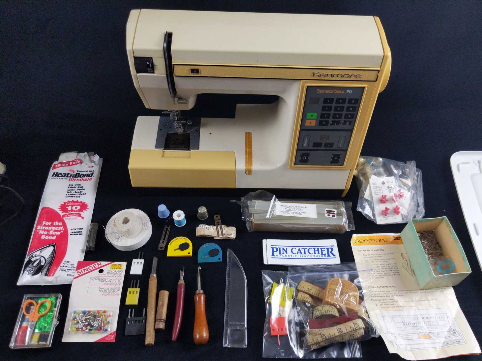 Kenmore Sensor Sew 70 Sewing Machine And More: Computerized Sensor Sew 70 model 385. Sew borders, monogram, zig zags, buttons and so much more! Memory button to memorize your pattern selection. Too many options to list. Says it will make you the s