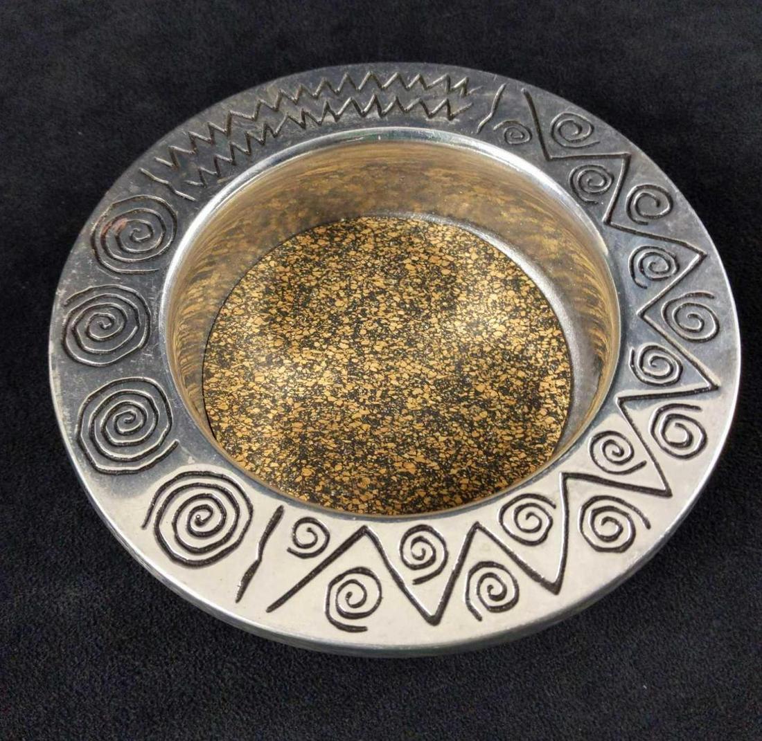 Wilton Armetale Reggae Wine Bottle Coaster: WILTON ARMETALE offers a creative way to cook and serve every day. This uniquely designed Wine Bottle Coaster is from our popular Reggae collection. The designs in this collection are evocative of the