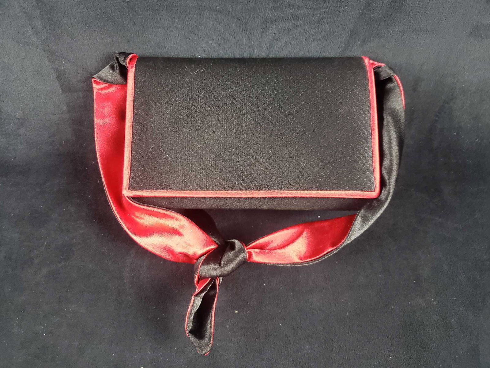 Sasha Handmade in China Black Satin Purse: Sasha Handmade in China Black Satin Purse. This black satin handbag is in great used condition. There is no known damage on the purse and the colors are not faded. The purse has a snap on the front an