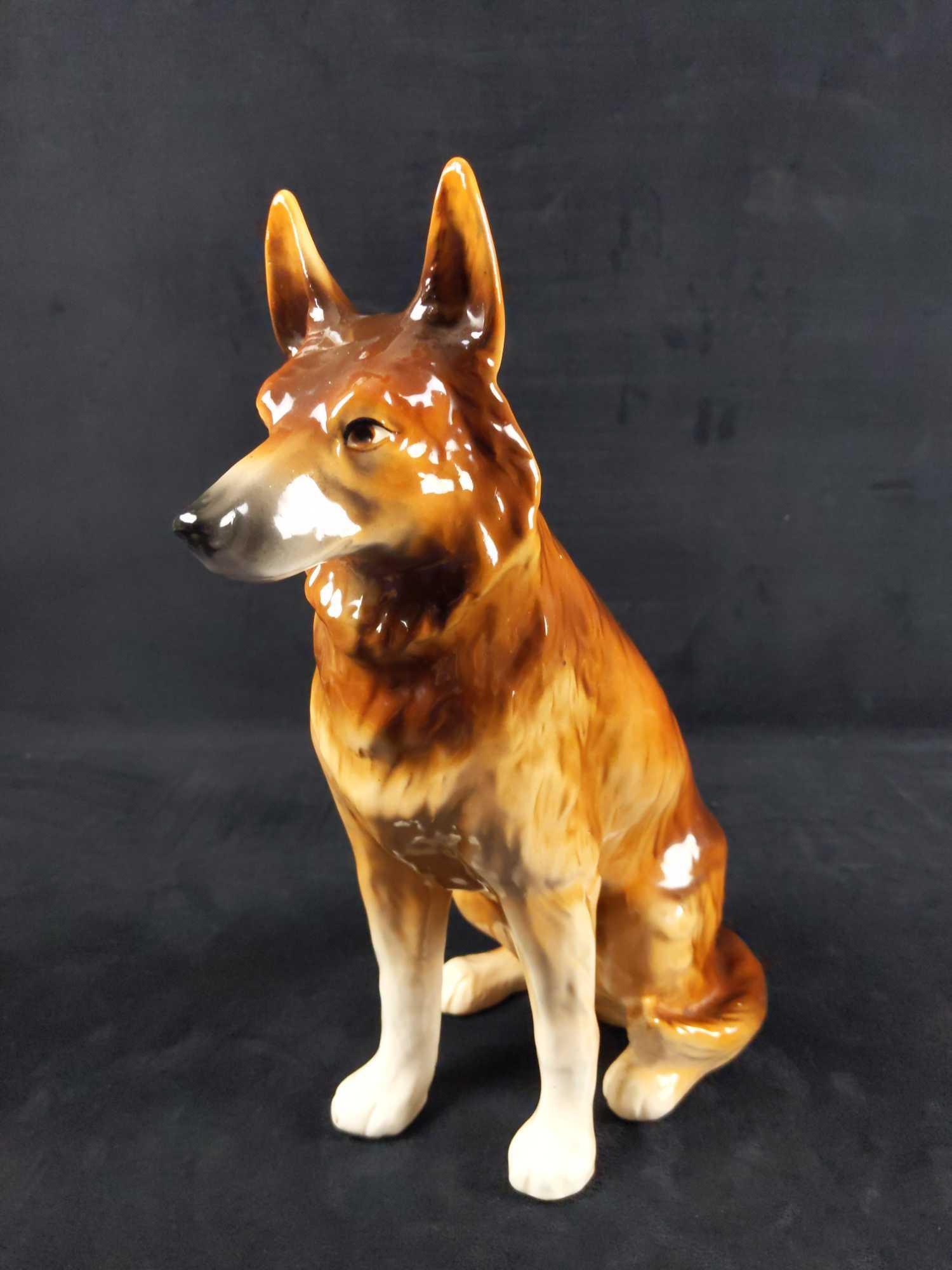 Vintage Slovakia Ceramic Large German Shepherd: A large glossy and glazed ceramic German Shepherd made in Slovakia. Statue is approx 6" x 8" x 13". The figure is in good, vintage condition and has small white spots you'll only see if you look very 