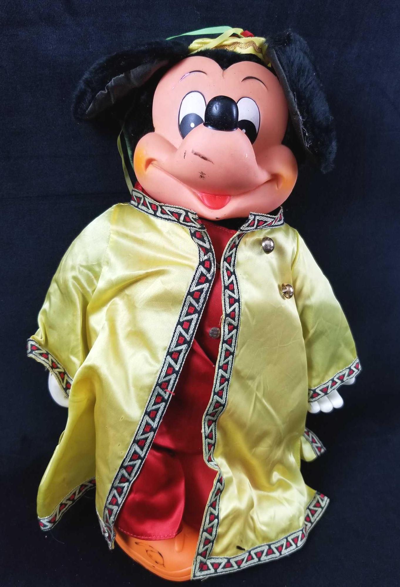 Vintage Mickey Mouse Doll by Walt Disney Productions: This Mickey Mouse doll appears to be from the 1980s. He is wearing a two layer outfit. The outer layer is yellow and the inner layer is red. The shoes are orange. The face is a hard plastic with a sof