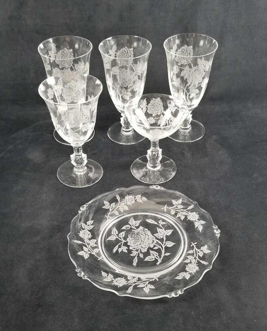 Crystal Heisey Etched Rose Assorted Plate and Stemware: This assorted lot contains 6 pieces of Heisey Etched Rose, lovely design. 3- Water glasses one has a minute chip at bottom rim, approx. measures 3 1/2" diameter x 6 3/4" 1- Wine glass, approx. measure