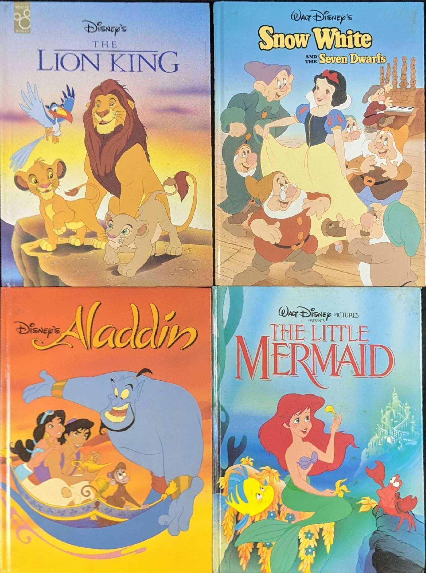 Four Hardcover Class Animated Disney Storybooks: This lot includes: (1) The Lion King. Adapted by Don Ferguson. Published by Mouse Works in 1994. (1) Aladdin. Adapted by Don Ferguson. Published by Penguin Books in 1992. (1) Snow White And The Seven 