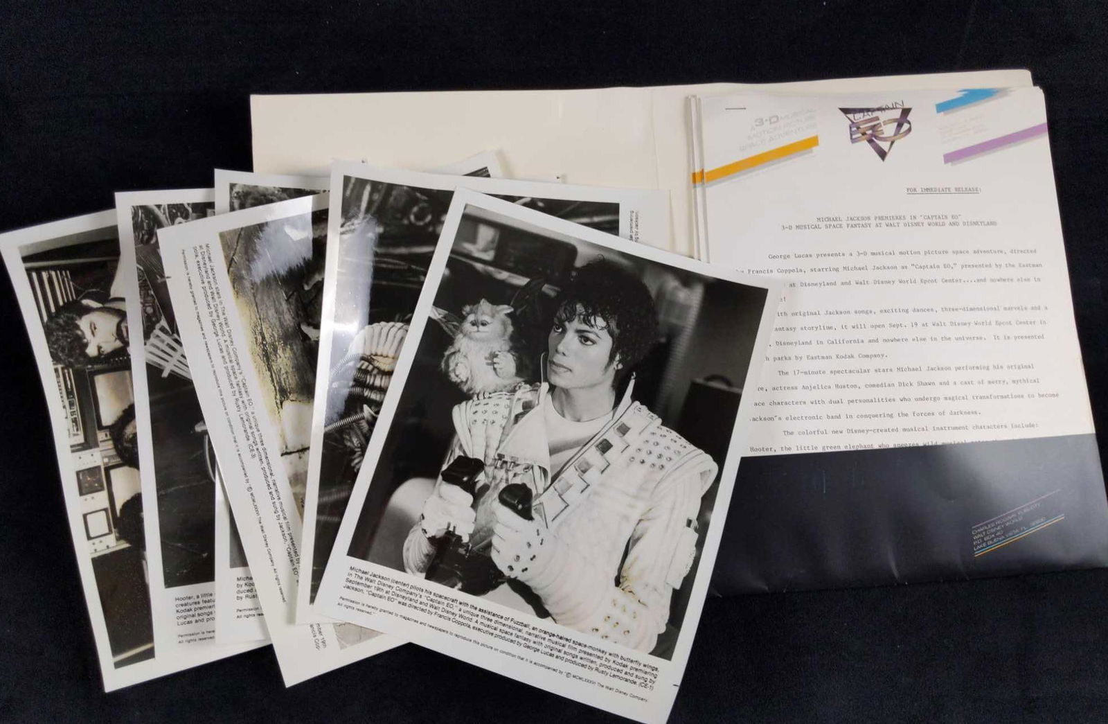 Disney Michael Jackson Captain Eo Publicity Folder: Here is a folder that was originally given out to members of the Press to inform them of the upcoming (at the time) attraction at the Disney parks. Captain Eo! It comes with six 8" x 10" photos from b
