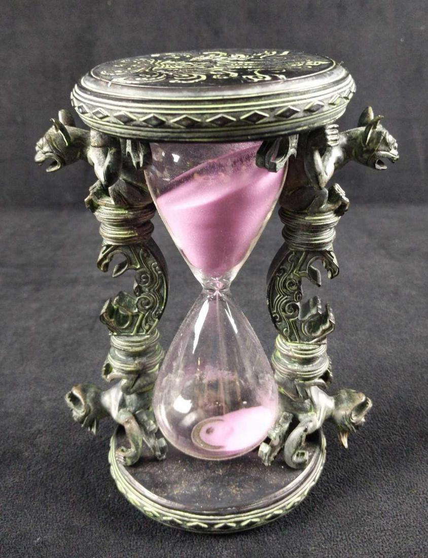 Disney Parks Haunted Mansion Anniversary Hourglass: Disney Parks 45th Anniversary Haunted Mansion Hourglass. Mark the hours of the mortal world with this elegant hourglass inspired by the delightfully dour decor of The Haunted Mansion. Turn the glass t
