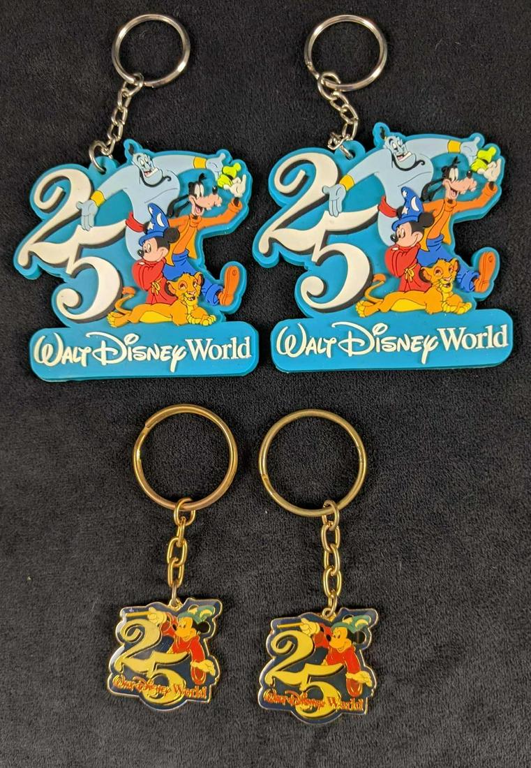 Disney 25th Anniversary Keychain Set Of Four: This lot includes: Two Walt Disney World 25th Anniversary Laser-Cut Rubber keychains. Two Walt Disney World 25th Anniversary Sorcerer Mickey keychains. Keychains are in good, used condition with no kn