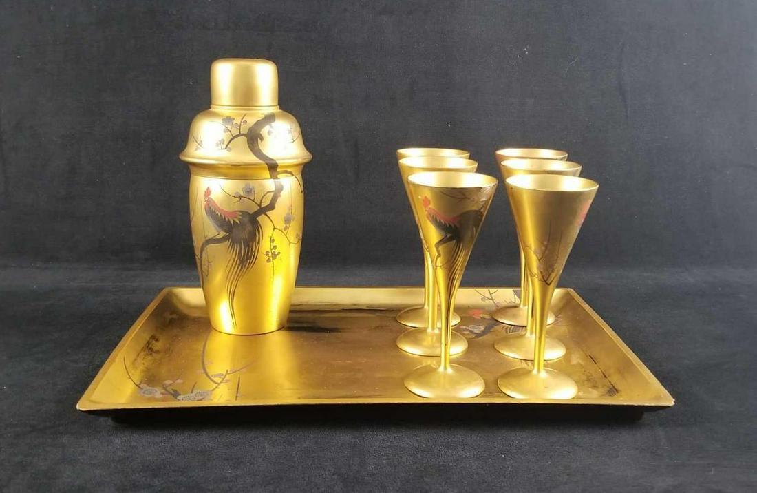 Vintage Gold and Black Lacqued Cocktail Set Rooster Art: Vintage Gold and Black Lacquered Cocktail Set Rooster Art is made in Japan and marked on the bottom. It comes with serving tray, 6 stemware, and 1 shaker. The base color is black with a prominent gold
