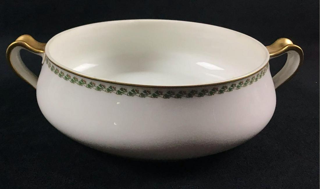Haviland France Vintage Circa 1900s Serving Dish: This is a Serving dish made in France. The bottom says Decorated by Haviland & Co Lim 31161. The base color is white with gold accents on the handles and lip. around the rim is a Green leaf pattern. I