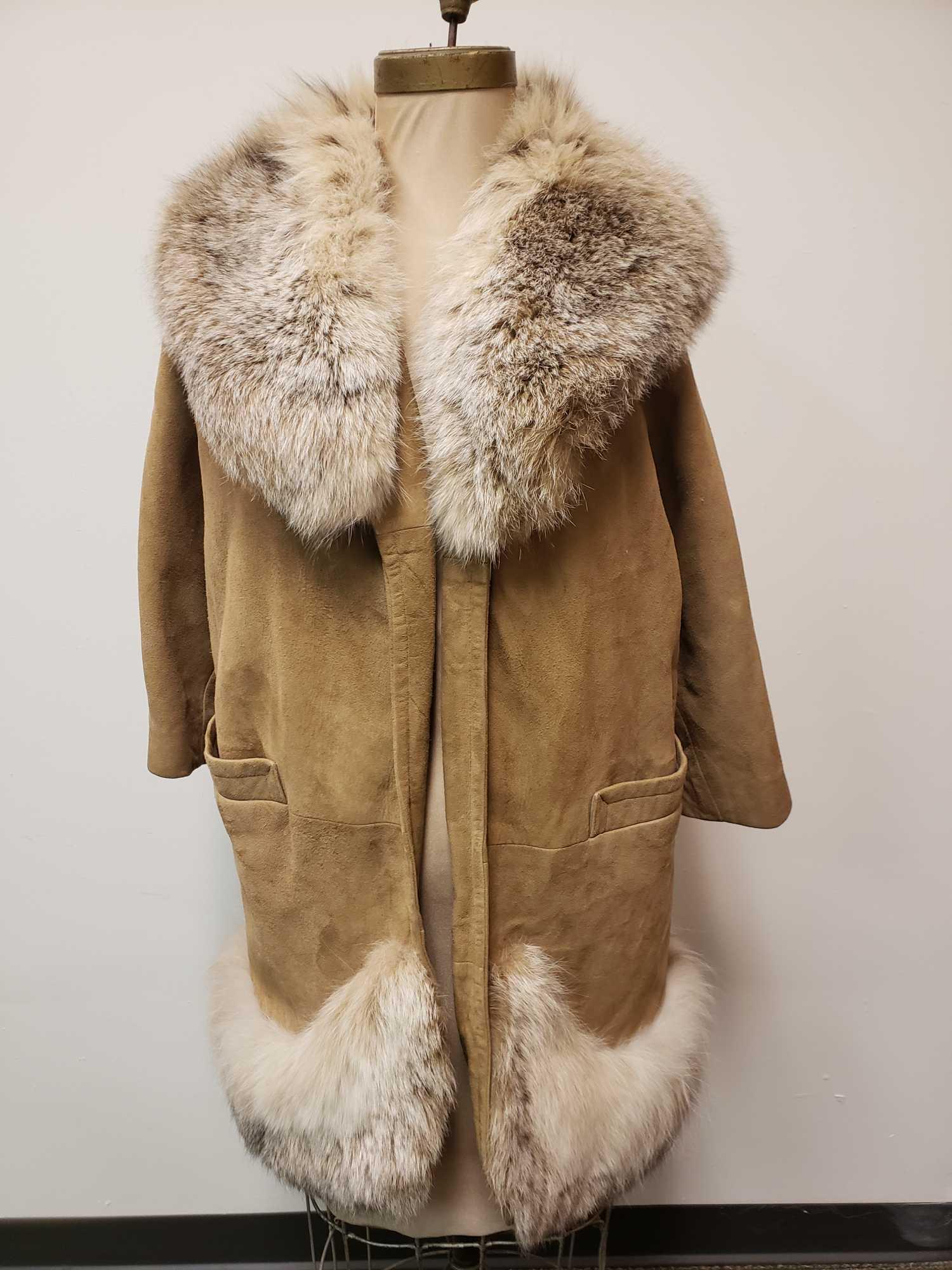 Gano Downs Suede and Fox Fur Jacket: Gano Downs Suede and Fox Fur Jacket. This fur jacket is in great used condition. The jacket has no known damage to the interior or exterior. The jacket has a suede body and fox fur collar and sweep. T