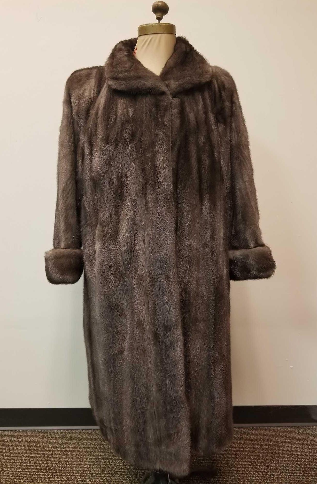 Full Length Gray Mink Fur Coat: This full Length Gray Mink Fur Coat is by an unknown manufacturer. It does appear as if a designer label was removed from the insideback panel (see images) but overall this coat is in very good condit