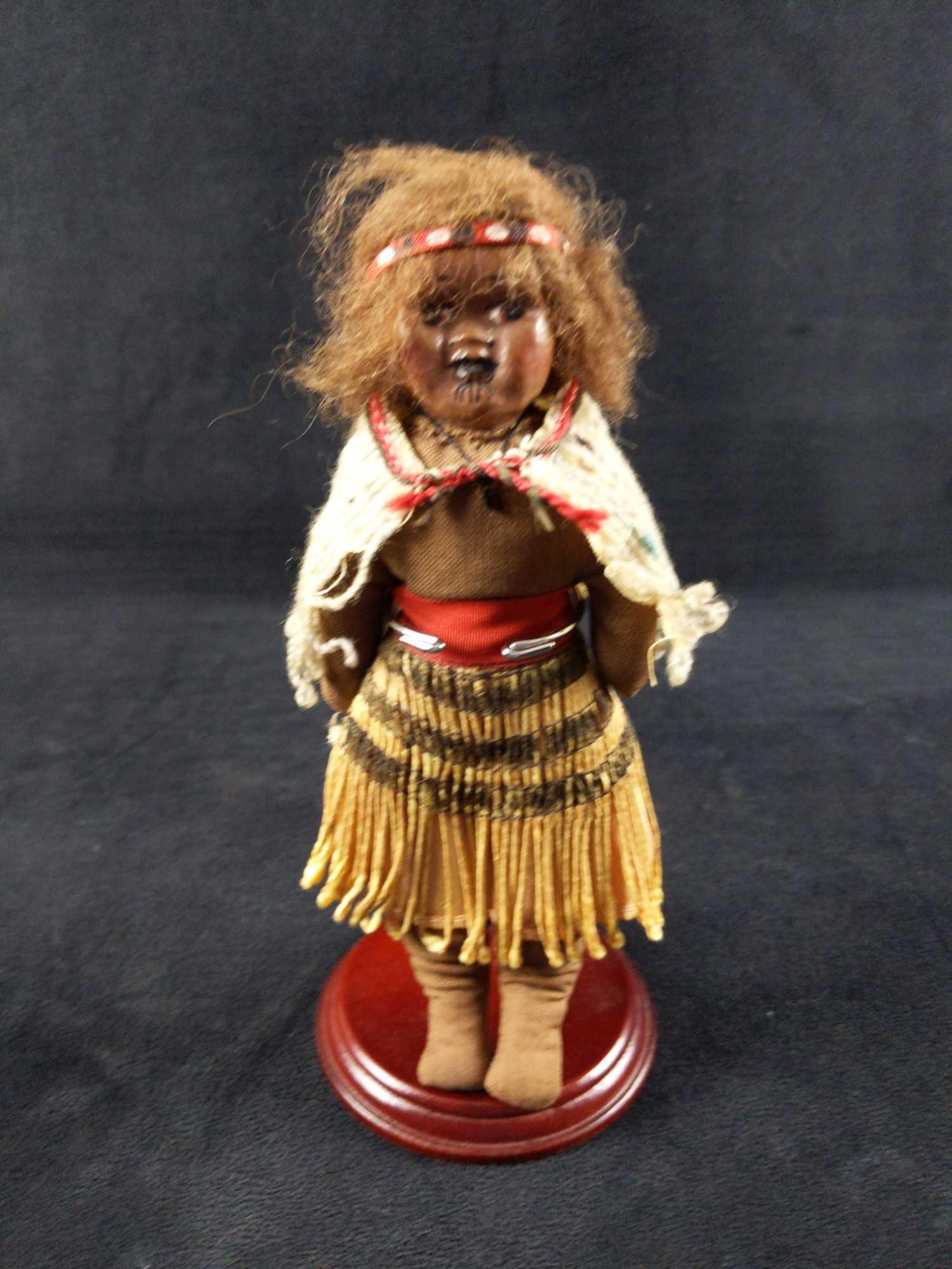 Vintage Brumfield Handmade African Tribal Doll: African Girl doll dressed in Tribal clothing. This is marked Brumfield, which could be a well known Seattle doll-maker named Elizabeth Brumfield. Doll has a plush body and a hand painted paper-mache f