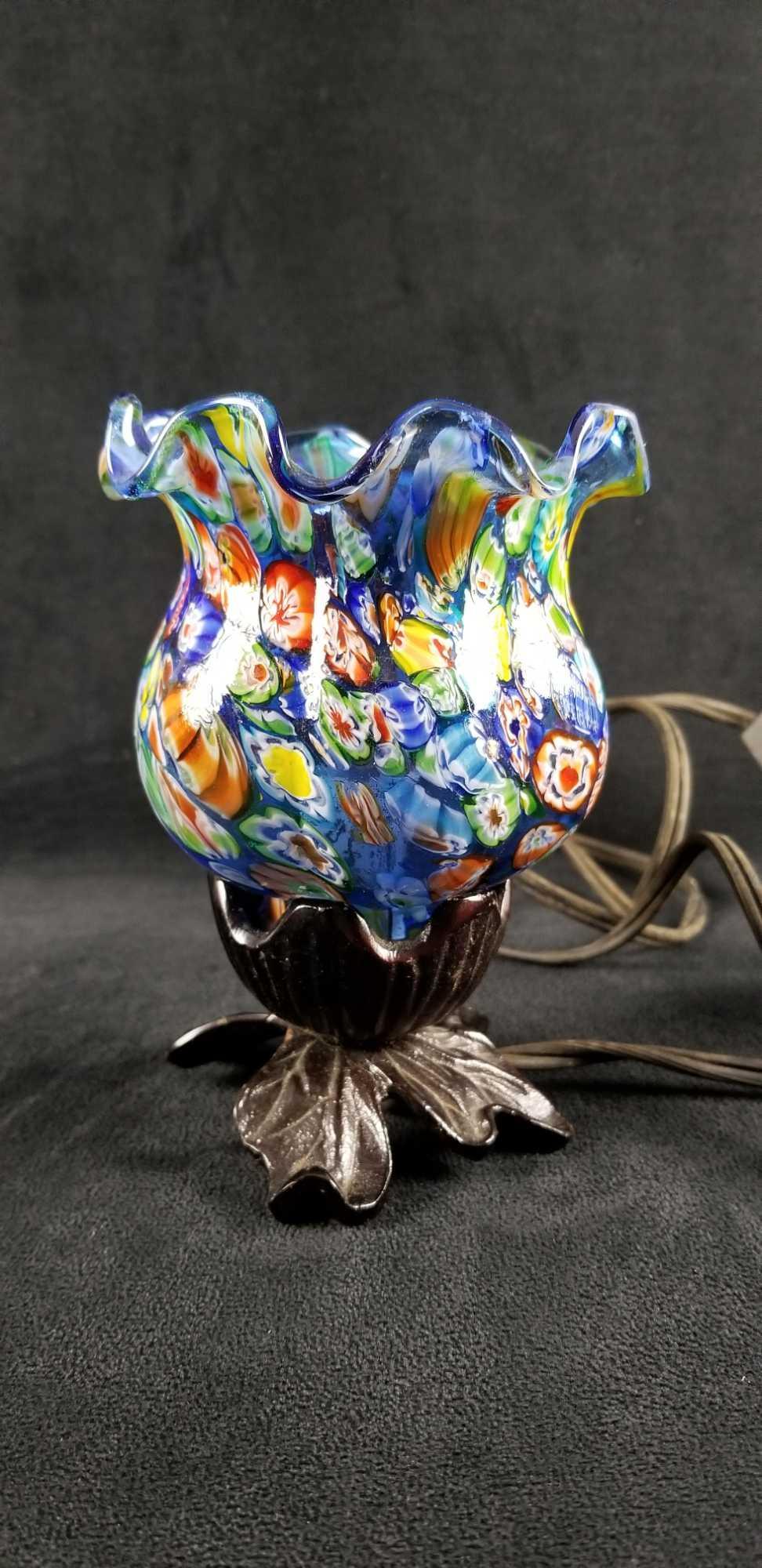Murano Style Millefiori Table Top Floral Lamp Light: Murano style Millefiori table lamp with metal base and open top glass shade. This is a dainty little light, take a 15 watt bulb. Unknown if it works. The glass shade is vibrant and is held to the base