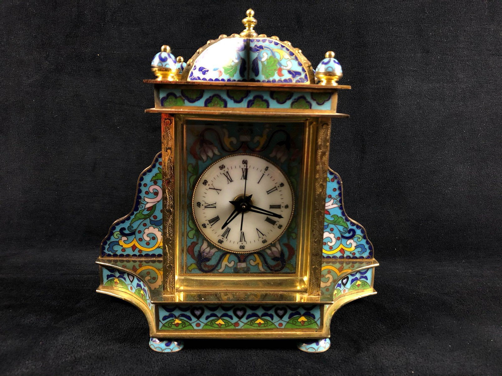 Vintage Chinese Cloisonne Dutch Enamel Working Mantel: Vintage Chinese Cloisonne Dutch Enamel Working Mantel Clock. This clock has blue enamel with pink, green, red and white, images of Victorian women are on the side panels and the clock has a beveled gl