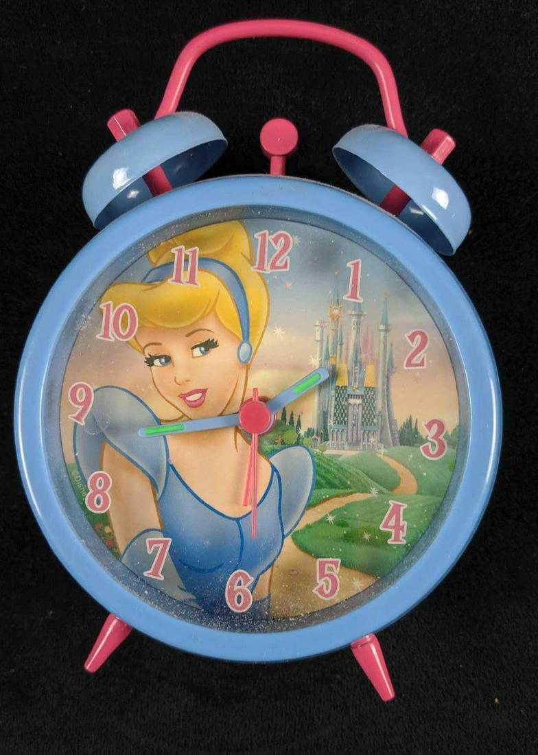 Disney Princess Cinderella Alarm Clock: This is for one Disney Cinderella alarm clock. Made of an hard plastic. This untested clock is in good condition with only a few light scuffs on the face. This measures approx 4" x 2" x 5".
