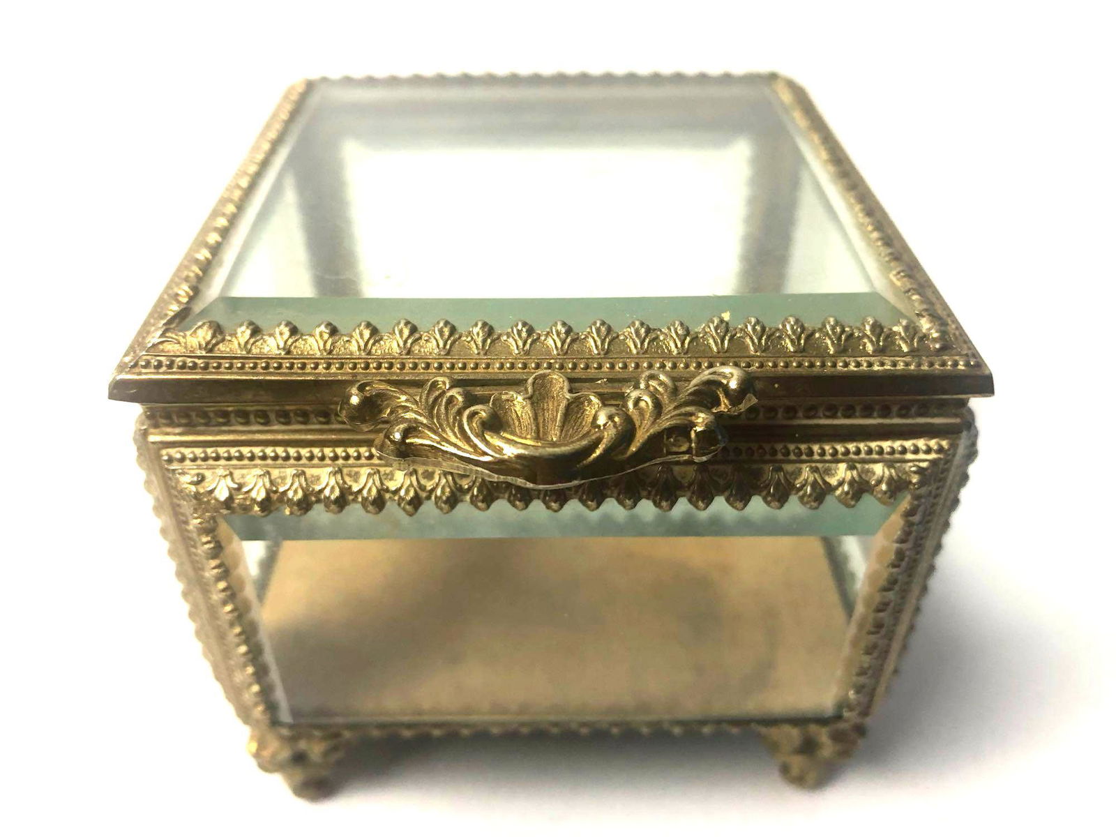 Antique 1950s Beveled Glass & Gilded Ormolu Brass: Antique Beveled Glass and Gilded Brass Jewelry Box - Vintage 1950`s. gold / yellow velvet lining. Condition is Good / Used. The glass has no cracks or chips please review the photos and ask questions