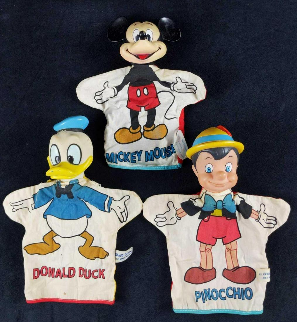 Vintage Disney Hand Puppets Mickey Donald: Vintage Disney Mickey Mouse, Donald Duck, and Pinocchio hand-puppets. These were made in Japan for Disney Productions in the 1960s. Their heads are made of rubber and their bodies are made of printed 