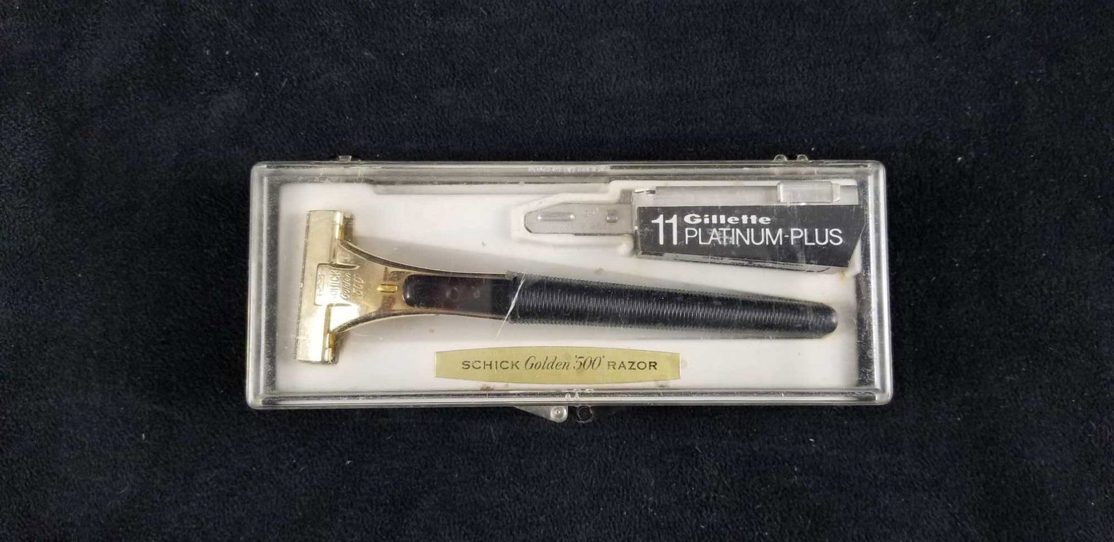 Vintage Schick Golden 500 Razor: Schick Golden 500 razor golden head with black base. Blade release on underside of head. Comes in case with blade case and tool. The tool is for a Gillette platinum plus razor which holds same size bl