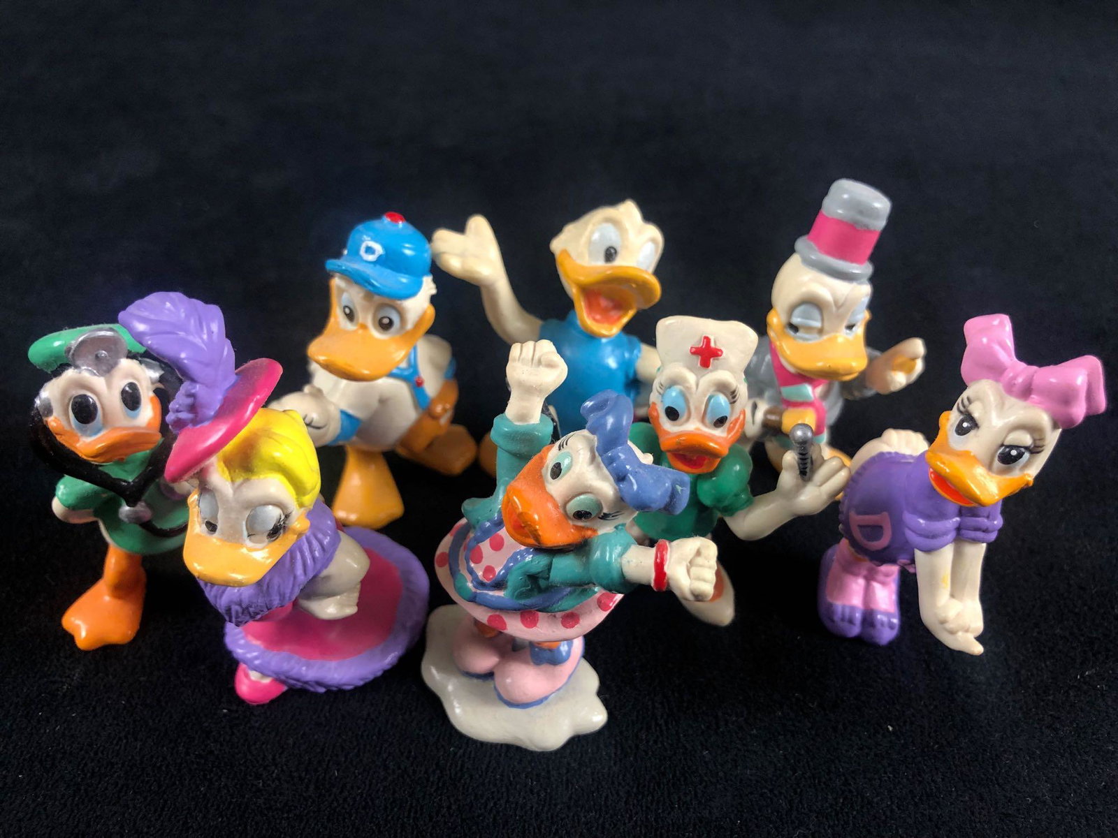 Lot of 8 Vintage Donald Duck Daisy Duck Figurines The: Lot of 8 Vintage Donald Duck Daisy Duck Figurines The Walt Disney Company Timeless Donald and Daisy are paired up and dressed in their outfits and features a fun iconic pose Appears to be from the 80'