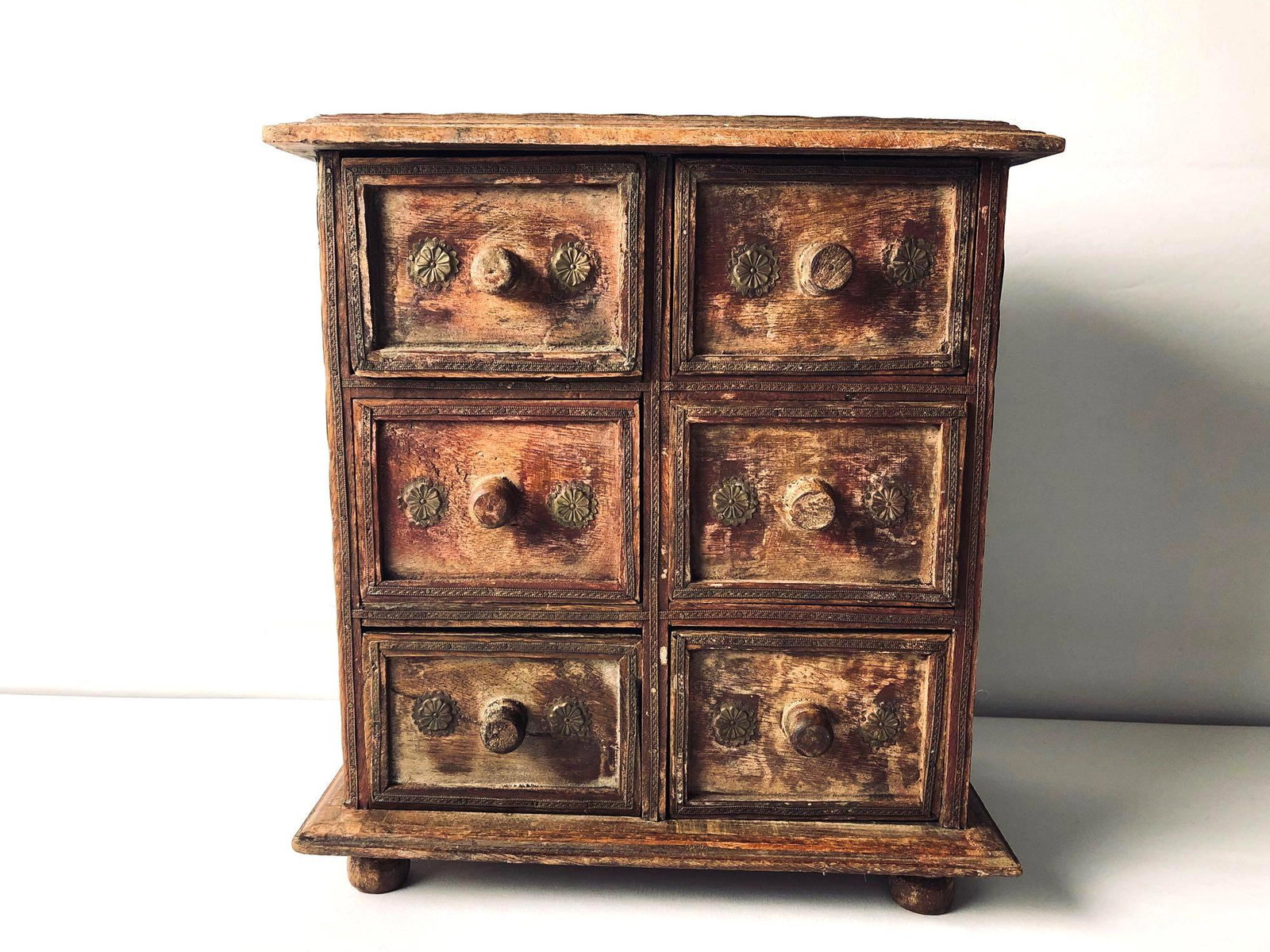 Small Vintage India Wood 6 Drawer Trinket / Jewelry: Small Vintage Wood 6 Drawer Trinket / Jewelry Chest . This very cool handmade wood box with 6 drawers is in good condition with signs of age . Measurements are 12" x12"x 7" 10 lbs