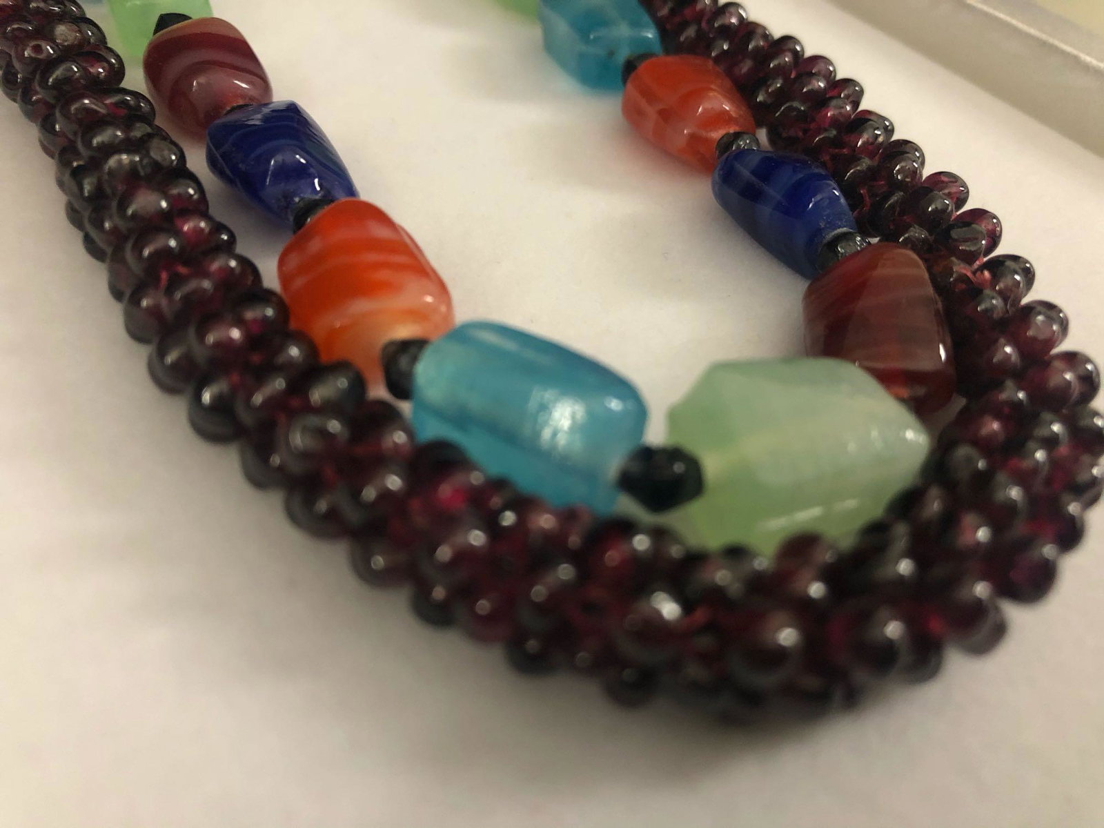 Vintage Natural Garnet & Multi Stone Necklaces: Vintage Natural Garnet & Multi Stone Necklaces. This auction includes the following : Natural Garnet hand strung necklace 24" 1/4" thick 91 grams Hand blown multi colored bead necklace 40" 1/4" thick 