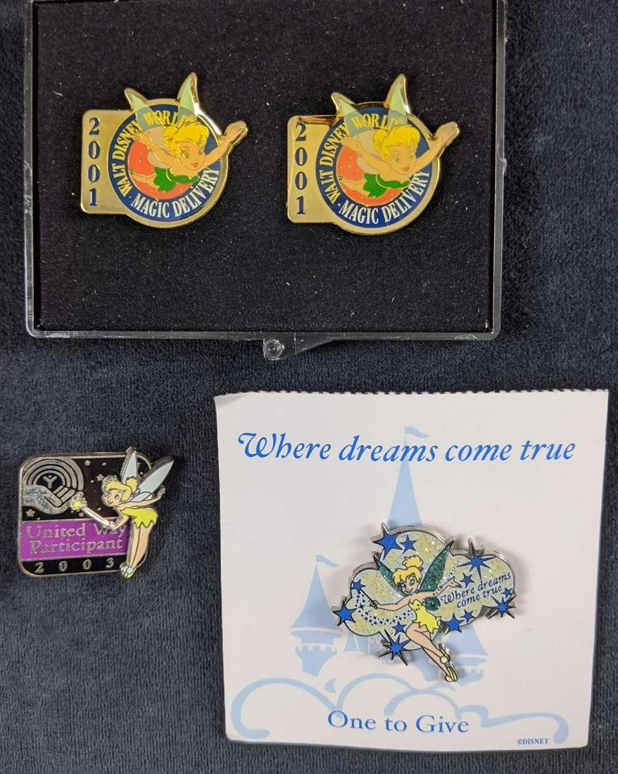 Disney Tinkerbell Lot Of Four Pins: This lot includes: One "One To Give" Tinkerbell Pin. This is a special pin that normally would not be sold, but only given or traded. Only "Dream Squad" cast members could hand these out. OneTinkerbel