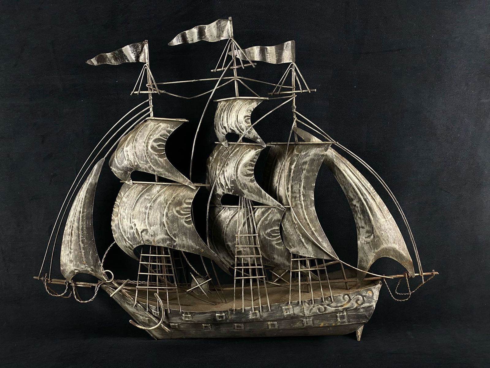 Vintage Handmade Tin Pirate Ship Sail Boat: Vintage Handmade Tin Pirate Ship Sail Boat . This very cool gray black hand bent tin metal pirate ship is in very good condition but could use all hands on deck for a nice dusting . Measurements of th