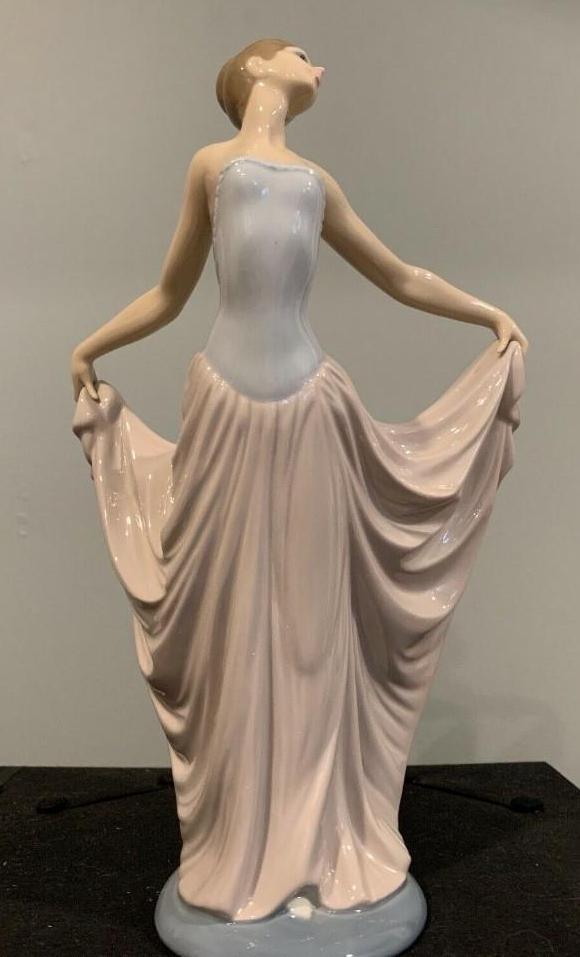 The Dancer Collectible Figurine by Lladro: Lladro #5050. "The Dancer". This piece depicts an elegant, graceful dancer in an arched back pose. In like new condition with no known damages such as chips, cracks or crazing. Stamped and etched by L