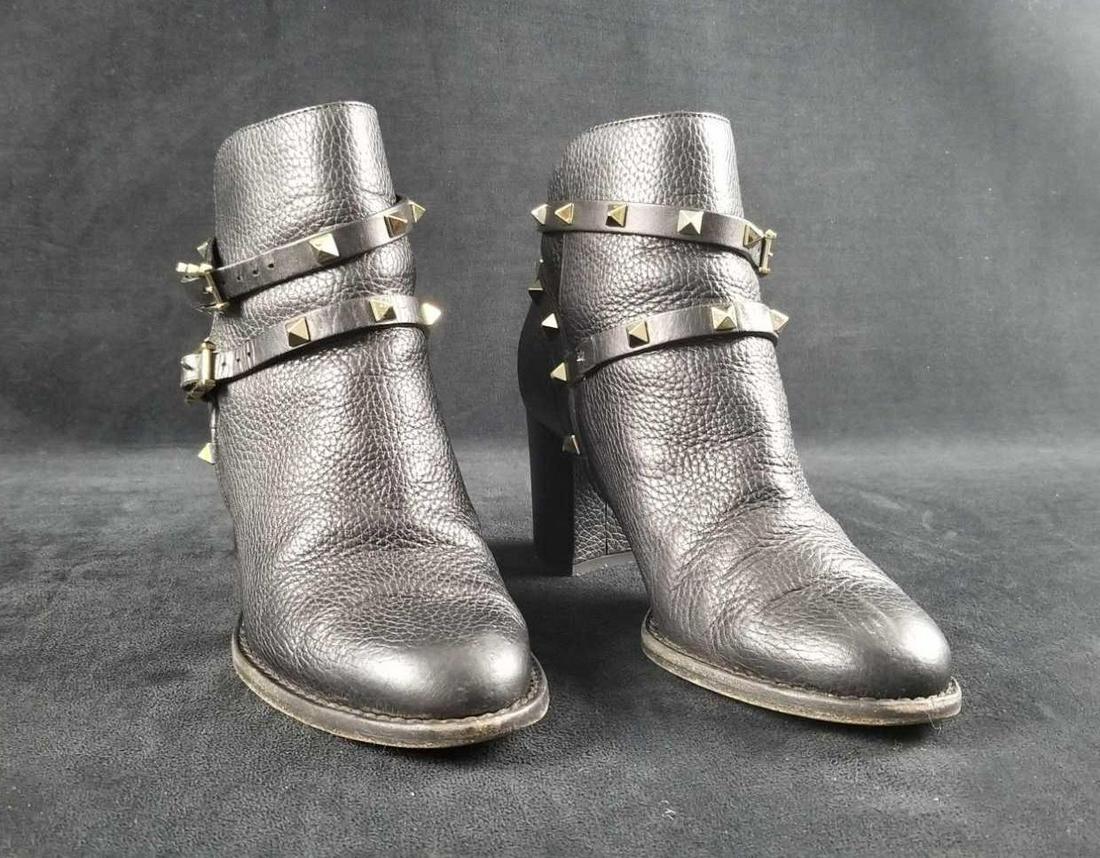 Leather Valentino Garavani Rockstud Ankle Chunky Heeled: Valentino Garavani Rockstud Ankle Heeled Boots are leather and made in Italy. They are a size 36 1/2 size, US size 5. It has a 2 1/2" heel height with a 3 1/2" width. Boots have a pointed toe. Straps 