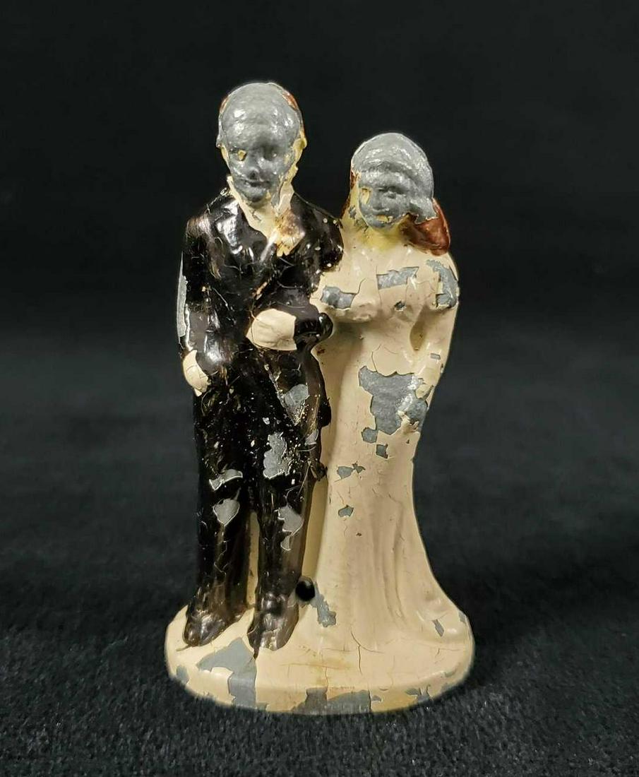 Barclay Lead Wedding Cake Topper 1940s: Offered are hand-painted bride and groom figures made from hollow cast lead. Groom is dressed in blue, while the Bride is in white. Figure is in vintage condition with a good portion of the paint miss