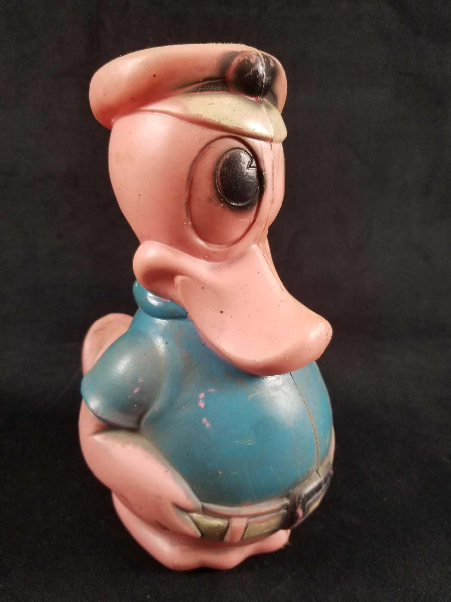 Vintage Disney Carolina Enterprises Donald Duck Bank: This is for one fun vintage Donald Duck piggy bank by Carolina Enterprises for the Walt Disney company. Measures 6" x 7" x 10". Molded plastic color has changed over the years, giving it an unique, vi