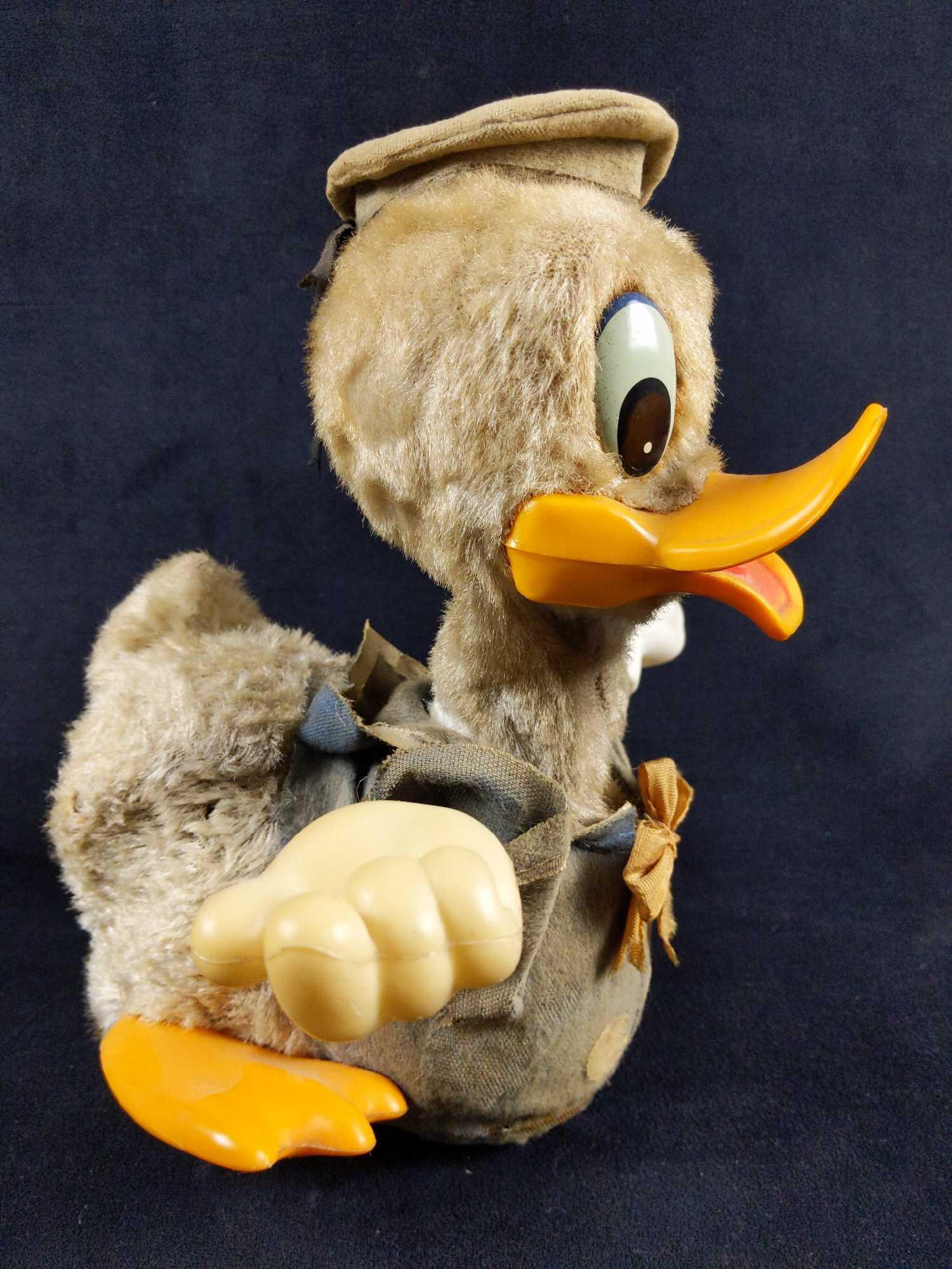 Antique Donald Duck Plush Battery Operated Toy: Antique Donald Duck Battery Operated Plush toy by Walt Disney Productions. This is a very unique toy that appears to be from the 1950-1960's.His body is made of a hard material but he has a fur exteri