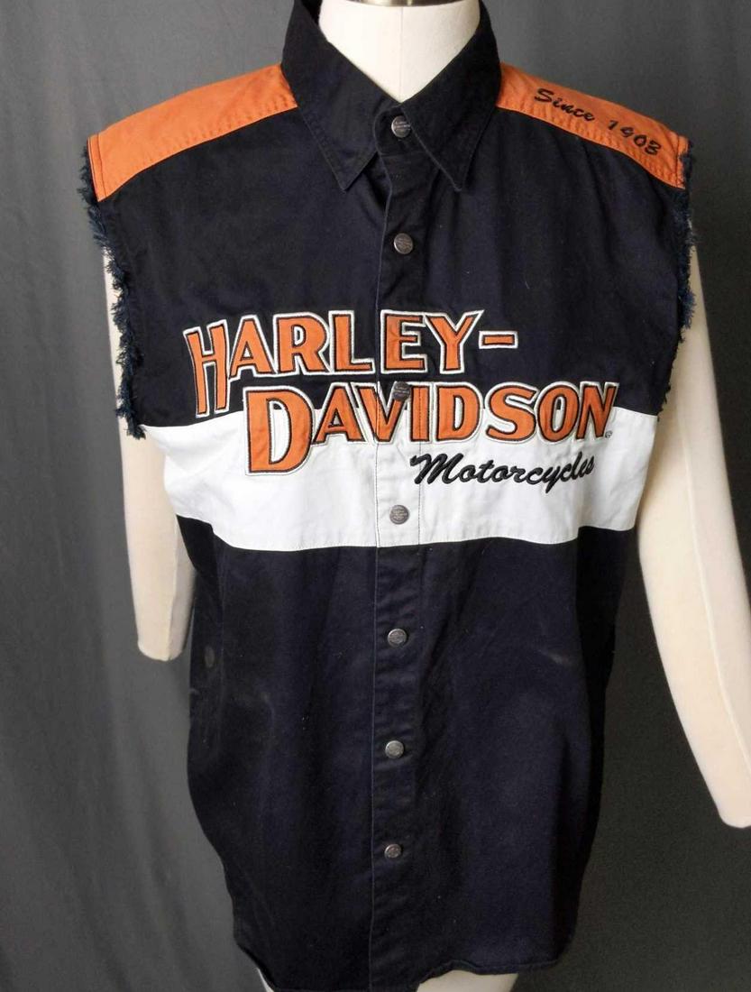 Harley Davidson Mens Sleeveless Shirt Size Large: Harley-Davidson Men's Prestige Blowout Orange Sleeveless Shirt 100% cotton twill shirt with snap front and blowout sleeve styling. Applique graphics on chest and embroidered graphic on the left should