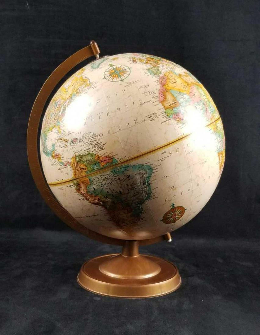 Replogle Globes 12 Inch Diameter World Classic Series: This Replogle 12" diameter globe is the World Classic Series made in the US. LeRoy M. Tolman was cartographer. The globe sits on a round plastic base. The globe is textured and raised to depict mounta