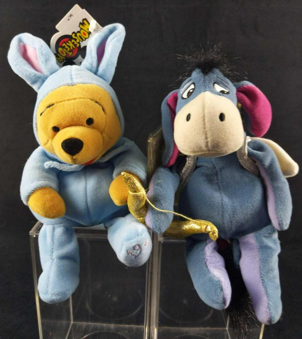 Two Disney Bean Bag Plush Cupid Eeyore Sleepy Pooh: This lot includes: (1) Cupid Eeyore. Doll is approx 6" x 4 1/2" x 9". (1) Winnie The Pooh In Bunny Pajamas. Doll is approx 5" x 3 1/2" x 9". Both come with protective acyclic cases that are approx 4" 