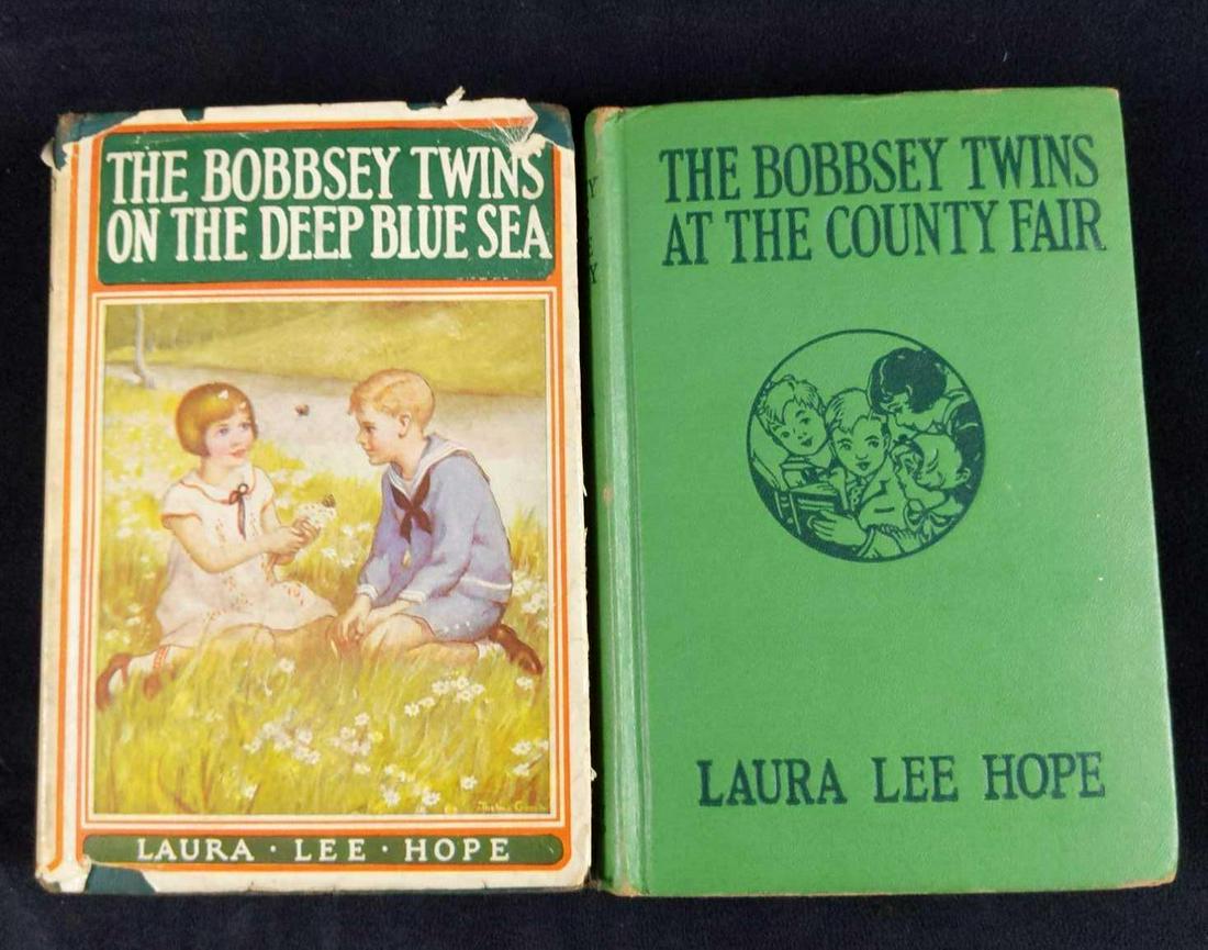 Antique Bobbsey Twins Books Lot Of Two: This lot includes: (1) The Bobbsey Twins On The Deep Blue Sea by Laura Lee Hope. Published in 1918 by Grosset and Dunlap. Book is approx 5 1/2" x 8". Book is in good, antique condition with wearing on