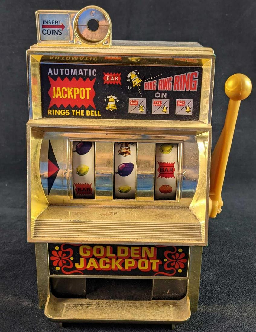 Vintage Golden Jackpot Automatic Jackpot 25 Cent Slot: Vintage Golden Jackpot Automatic Jackpot 25 Cent Slot Machine. Takes quarters. Is made of hard plastic. Tested and it works. Is approx 6" x 7" x 11" and is in a good, vintage conditon with some wear a