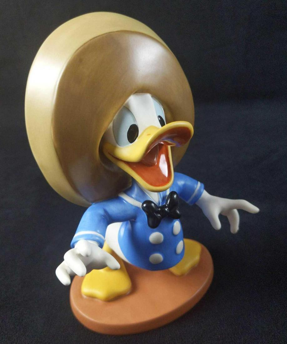 Disney Figurine Donald Duck Three Caballeros: Walt Disney Classics Porcelain "Three Caballeros" Donald Duck figurine. This was part of a series Disney released from 1995 - 1996 to celebrate the Duck's 60th Birthday. Figurine is approx 5" x 3" x 7