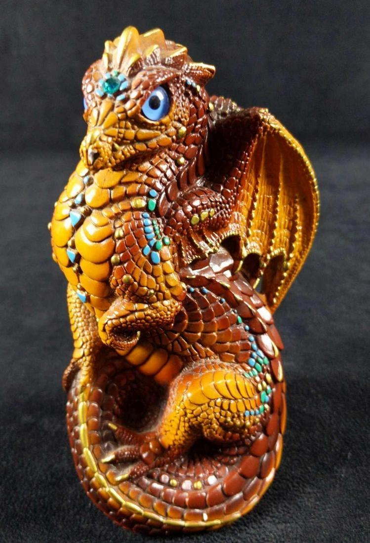 Retired Windstone Brown W Turquoise Young Dragon: Windstone Editions Brown Young Dragon with Turquoise And Gold Highlights. He is made of a cast gypsum stone (a form of very hard, dense plaster). He was painted with acrylic paint and sealed with a cl