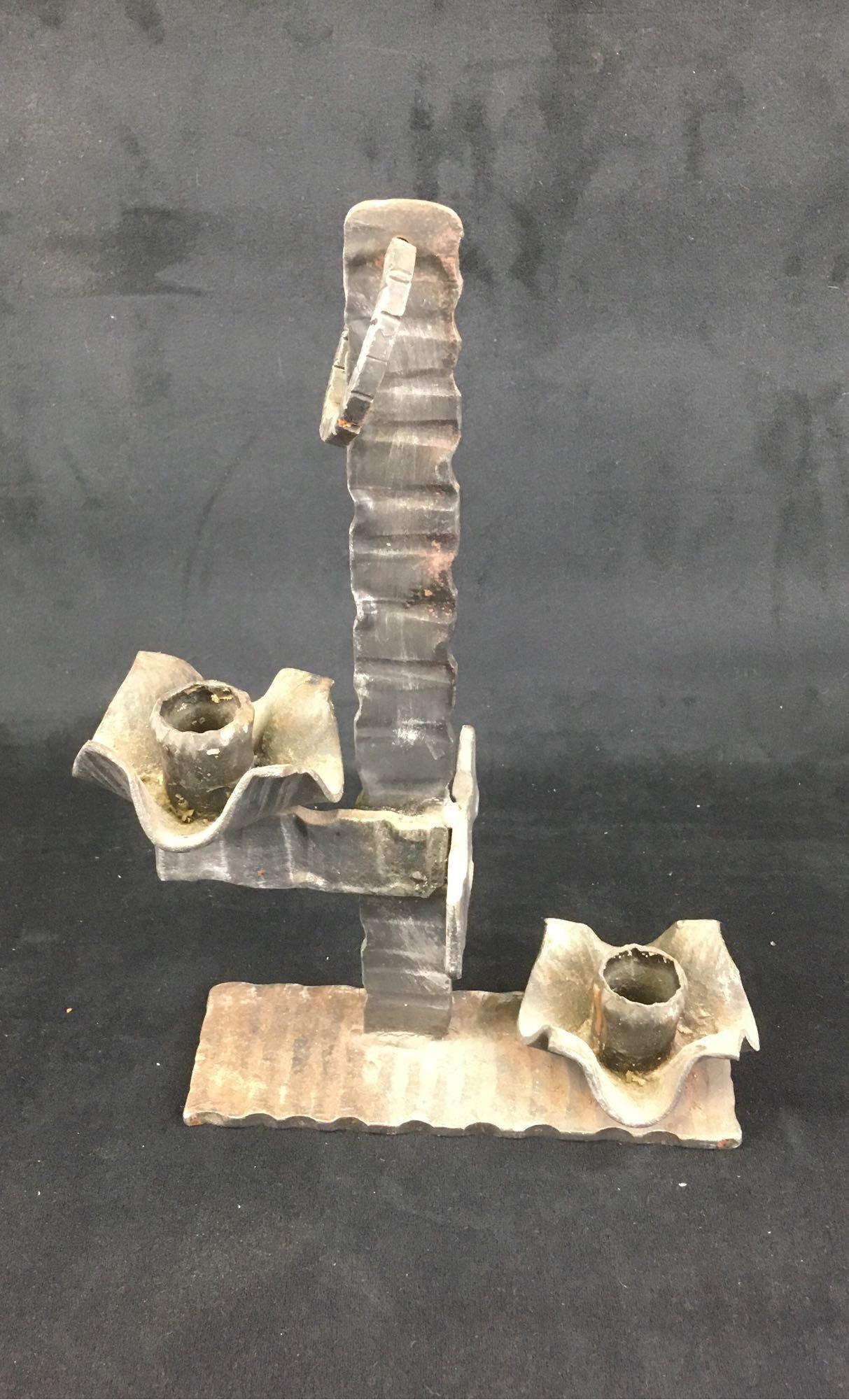 Vintage Gothic Style Candelabra: Vintage Gothic Style Candelabra; It holds two candles and has a man made patina on it that gives it a very rustic, Spanish style. It measures at approximately 2 1/4" L x 7" w x 11 1/2" H.