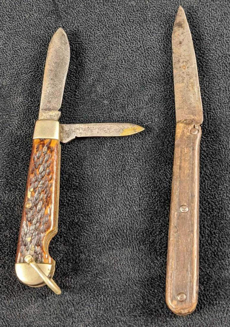 Two Vintage Fold In Pocket Knives Camillus B: This lot includes: (1) Two Bladed Fold In Pocket Knife By The Camillus Cutlery Company. Is approx 3 1/2" when the blade is in and is approx 6" when out. Knife has some wear on both the handle and blad