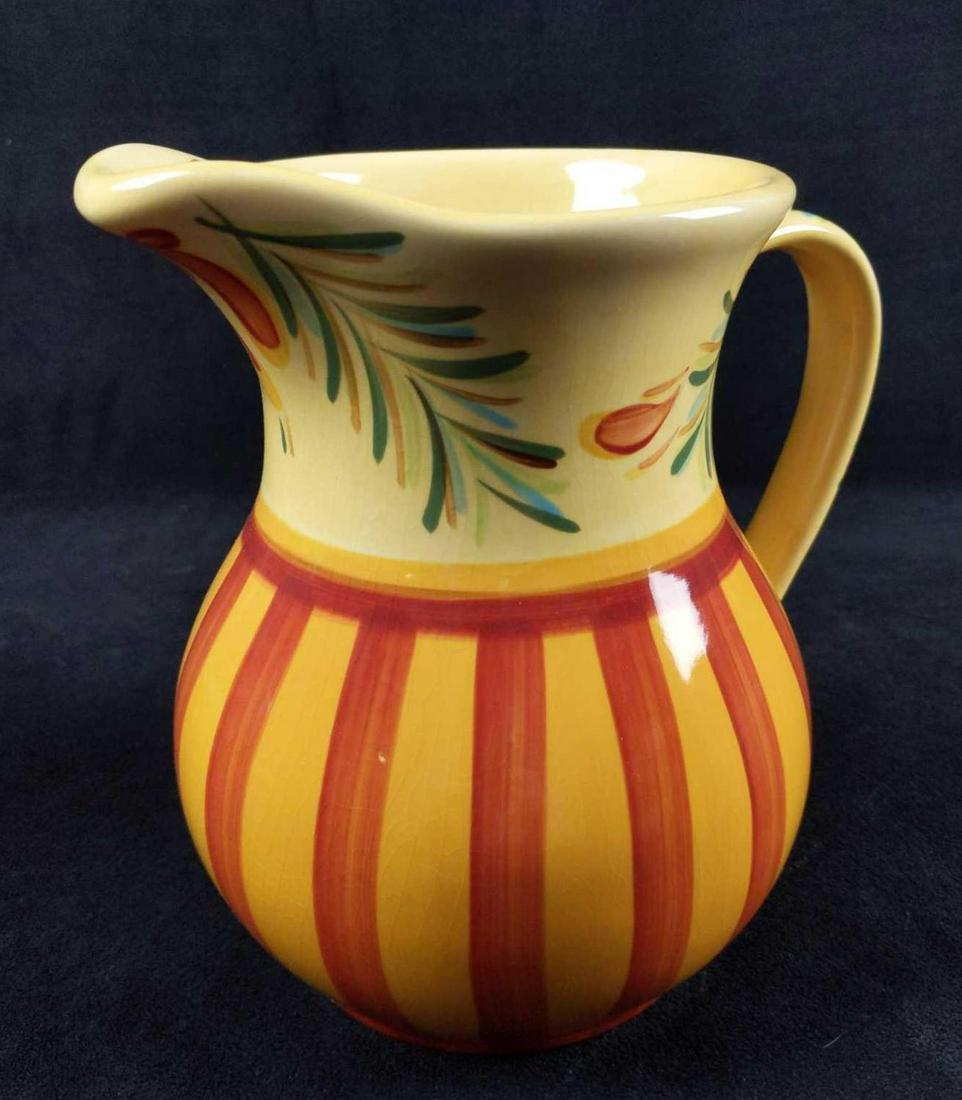 48 Oz Sienaby Pitcher By Gail Pittman: 48 Oz Sienaby Hand Painted Pitcher By Gail Pittman. The bright and cheerful ceramic pitcher has plenty of yellows and oranges and to brighten up any kitchen or dining room. Pitcher is approx 8 1/2" x 