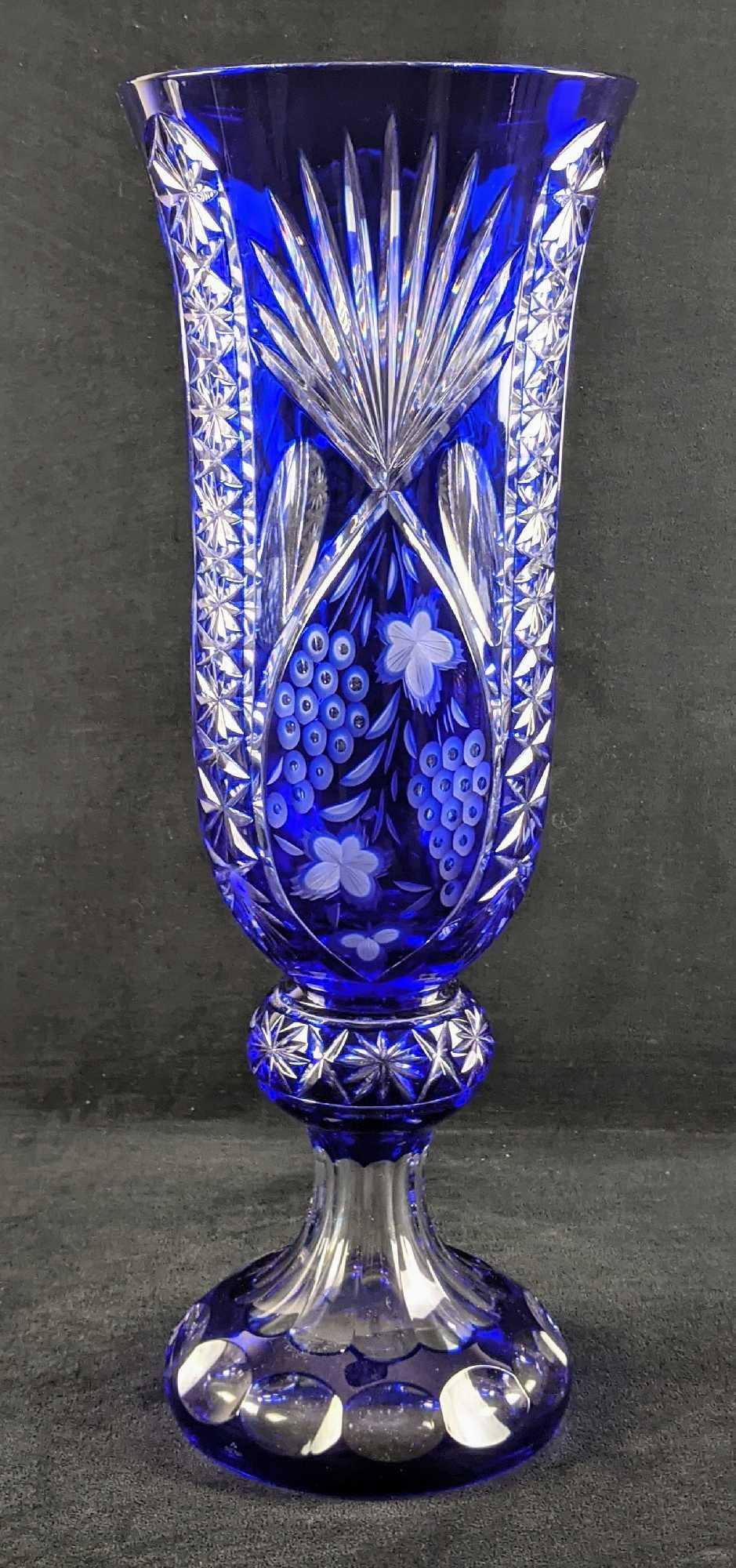 Large Blue Bohemian Czechoslovakia Crystal Vase W3: Large Blue Bohemian Czechoslovakia Crystal Vase. Heavy textures of grapes, palm leaves, and more. Vase is approx 7 1/2" x 7 1/2" x 20 7/8". The crystal is high-quality 24% lead, making this a dense, f