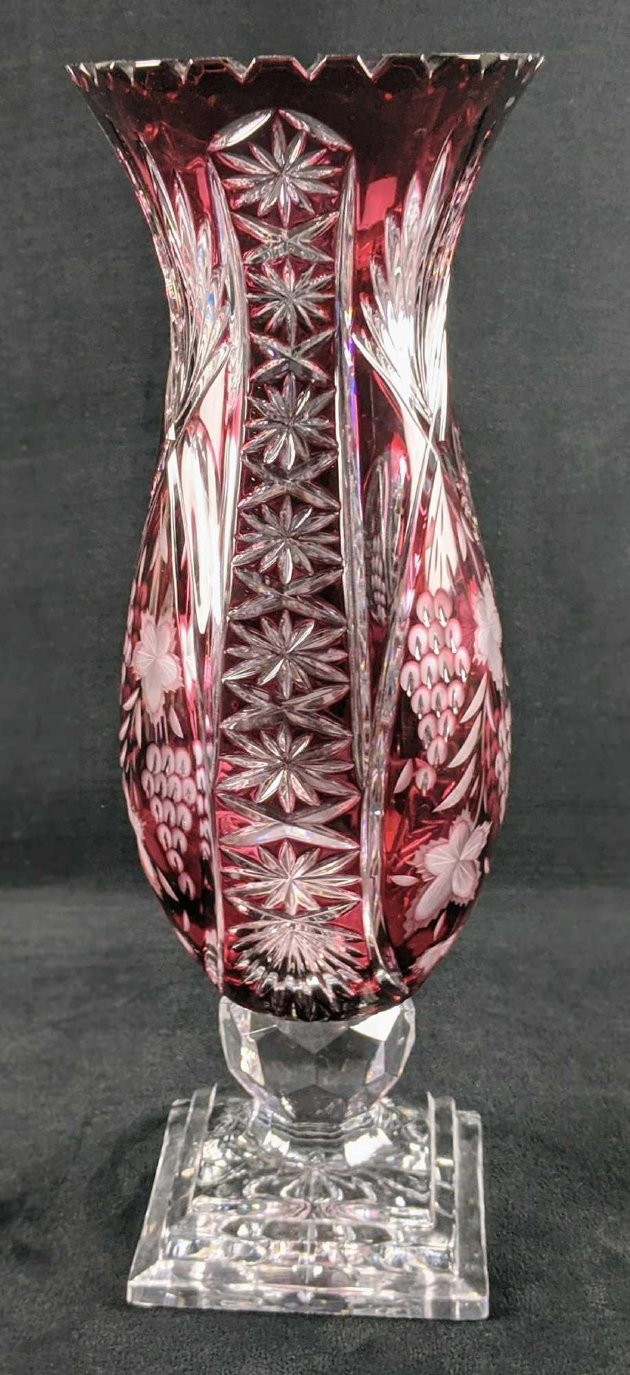 Ruby Red Bohemian Czechoslovakia Crystal Vase W3: Ruby Red Bohemian Czechoslovakia Crystal Vase. Heavy textures of grapes, palm leaves, and more. Vase is approx 4 3/4" x 4 3/4" x 15 1/2". The crystal is high-quality 24% lead, making this a dense, fir