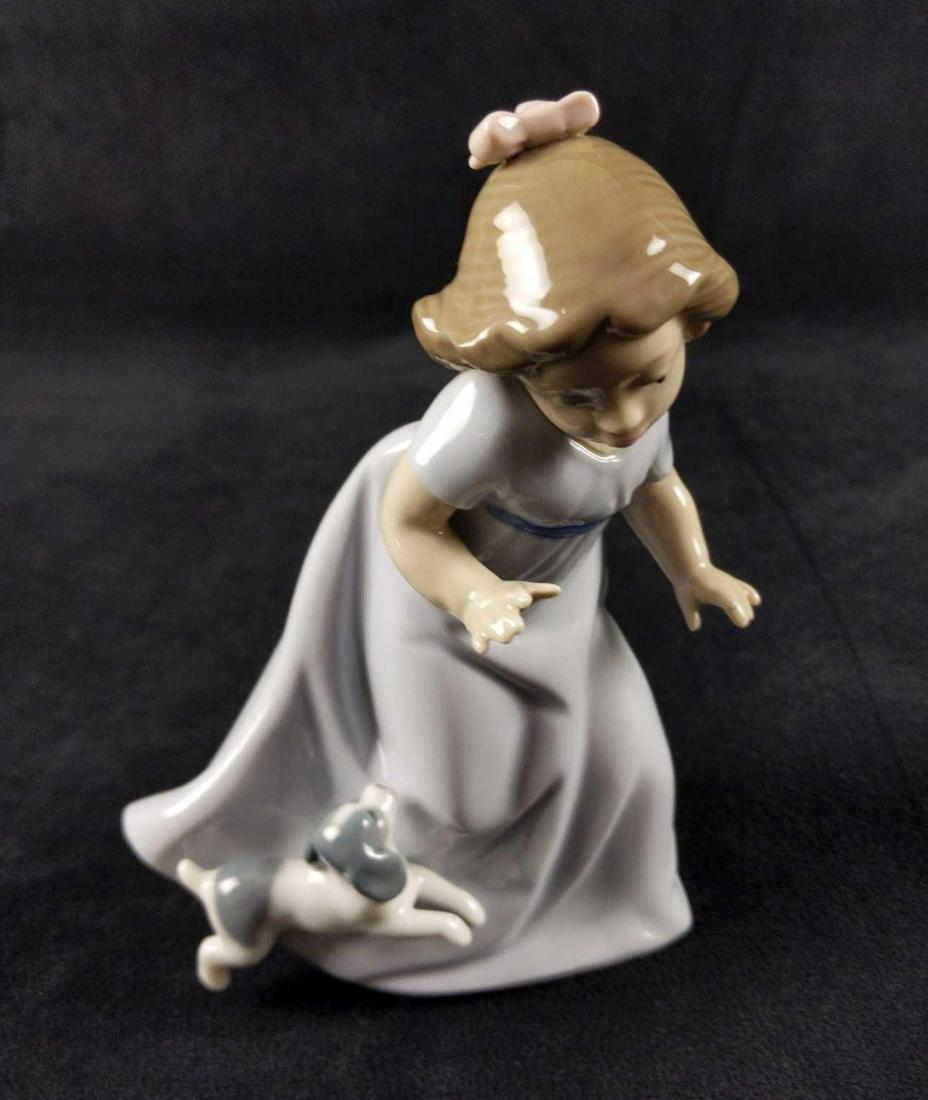 Nao Lladro Porcelain Girl Running with Puppy Spain: Nao hand made Porcelain "Girl Running with Puppy" figurine that was designed by Vicente Martinez in 1992. Figurine is approx 4" x 3" x 6". Figurine comes in its original box which is approx 10" x 5" x