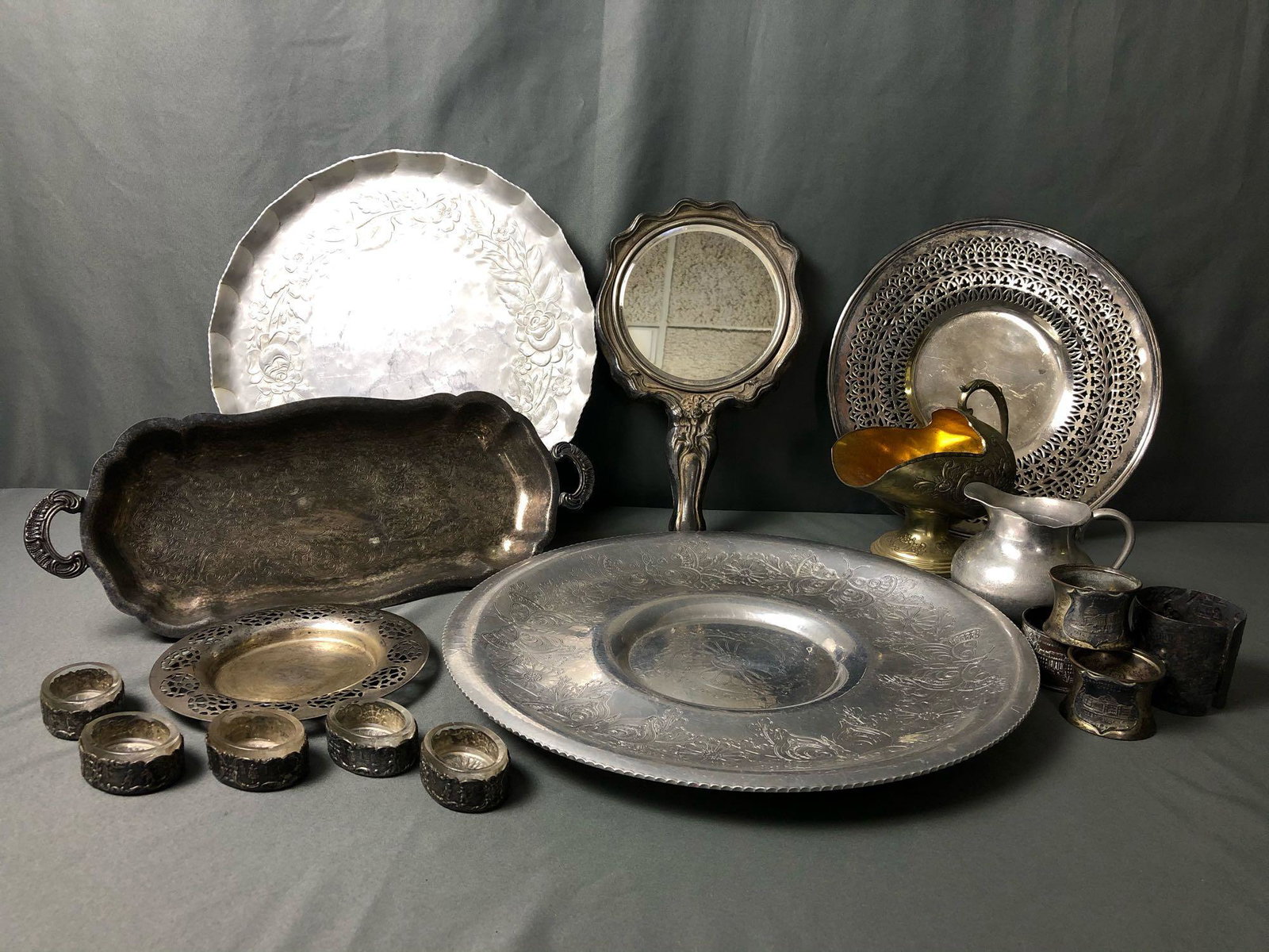 Vintage Mixed Lot Of Silver Plated Trays -Creamer -: Vintage Mixed Lot Of Silver Plated Trays -Creamer - Napkin Rings - Repousse Mirror. Everything you see will be included this lot great for resale or flea markets .Please look at all our pictures they 