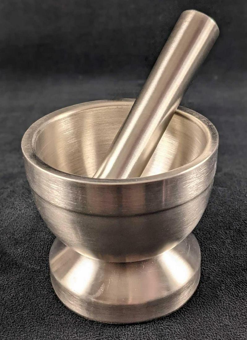 Multifunctional Brushed Nickel Pill Crusher Mortar: Multifunctional Brushed Nickel Mortar Pestle. Can be used to grind garlic, pills, nuts, etc. Is approx 4" x 4" x 3 1/2" Is in a good, used condition with light wear. Maker and date of creation is unkn